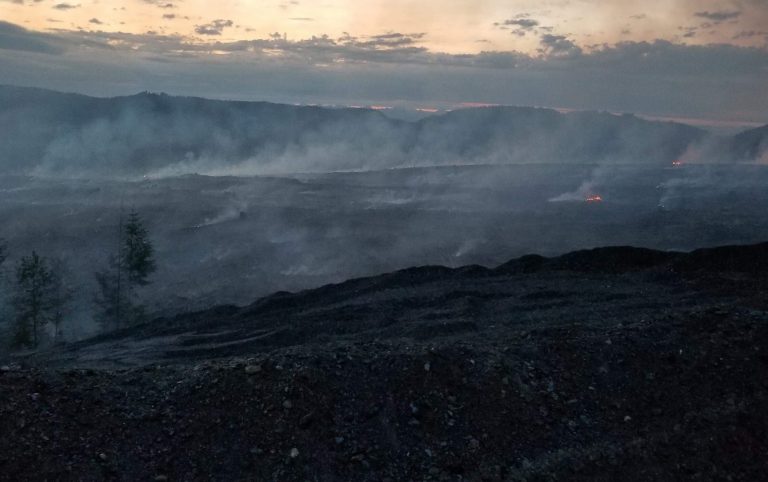 Quinsam fire officially held, still burning