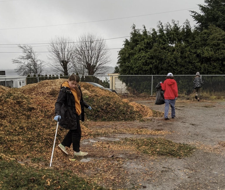 Island middle school students help clean-up the streets